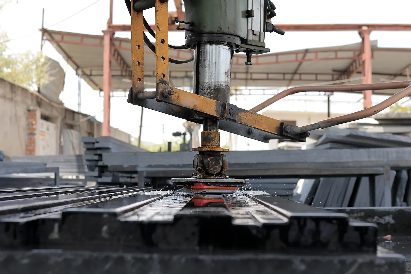 Machine polishing black granite